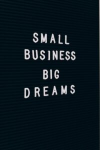 Close-up of a motivational quote about small business dreams on a letter board for small companies.